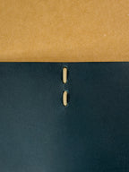 outside closeup view of an open leather journal laying flat