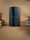 A tri-fold blue leather journal on a beige background