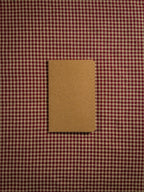 A small brown pocket sized paper notebook sized at 3" x 5.5"